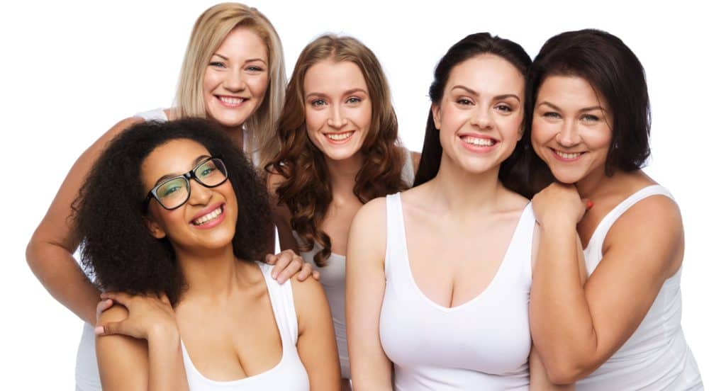 group of happy different women in white underwear
