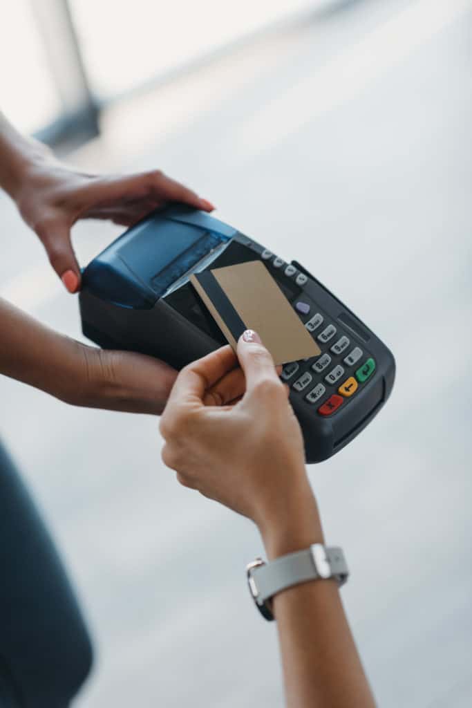 woman paying with credit card