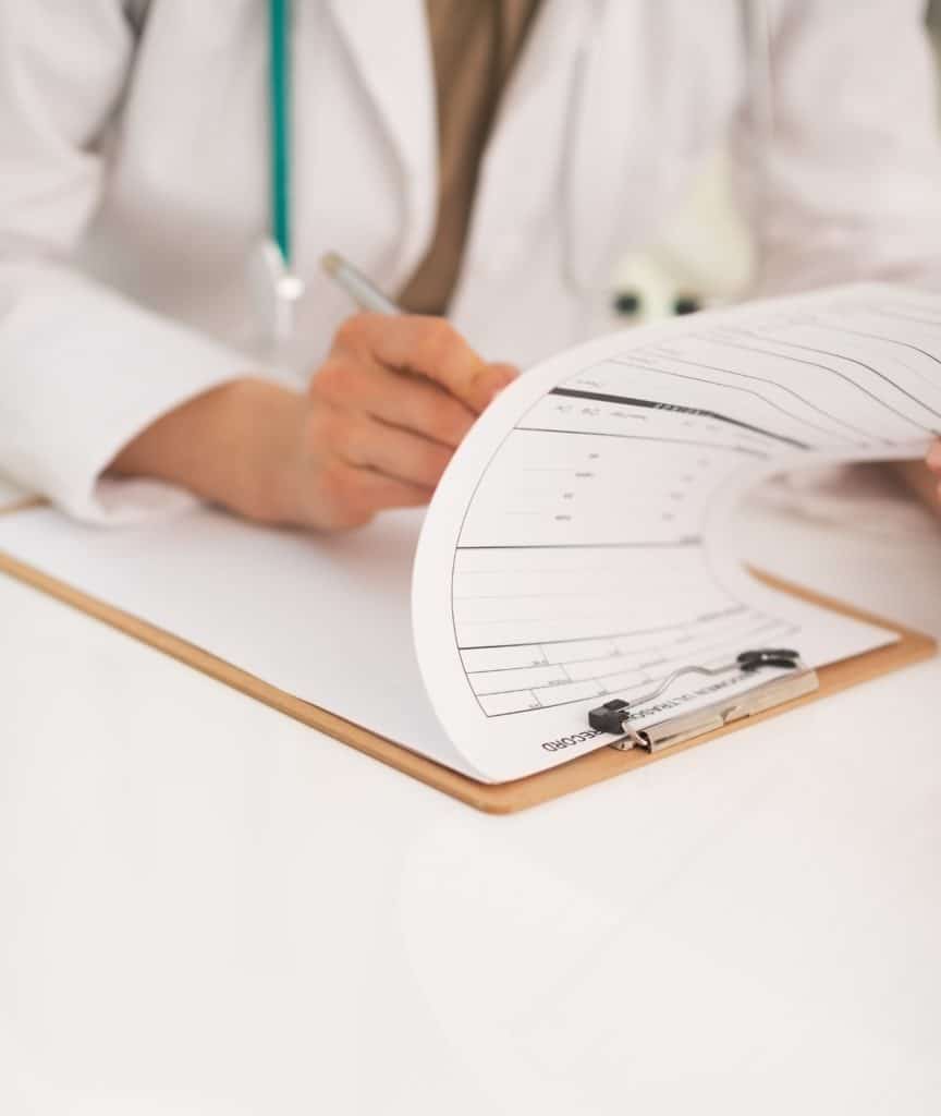 Closeup on doctor woman working in office