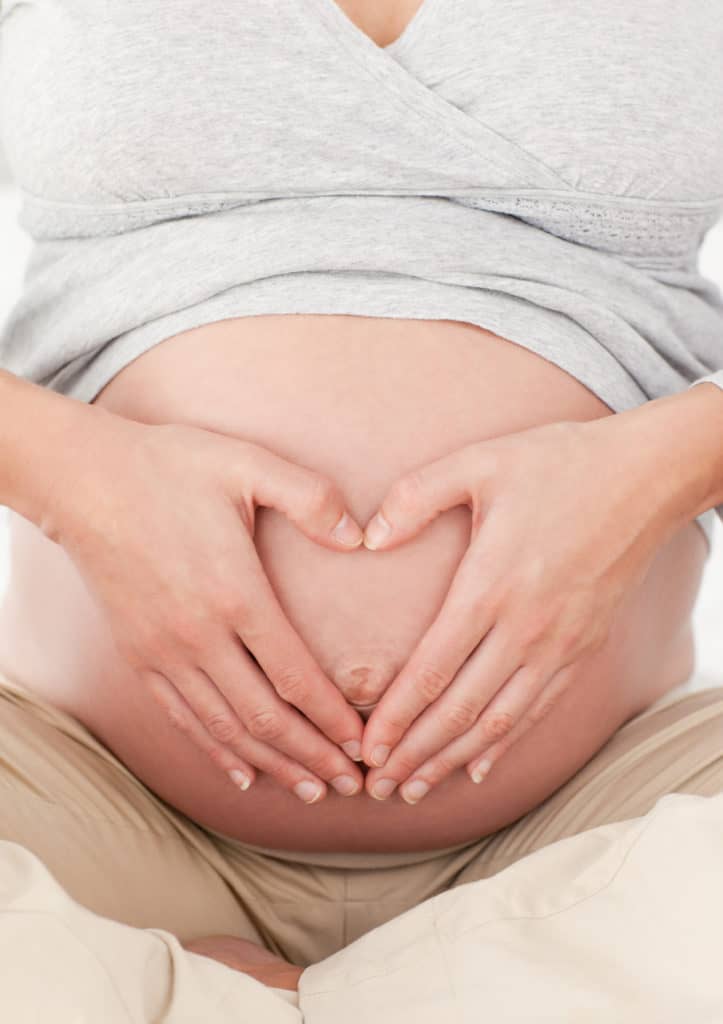Pregnant Woman Holding Her Belly