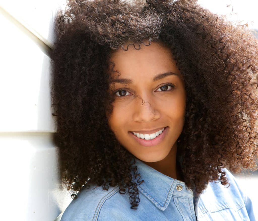 Attractive young black woman smiling